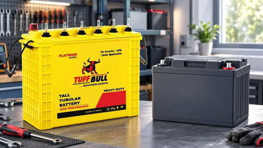 Tuff Bull tall tubular battery compared with an SMF battery on a workshop table